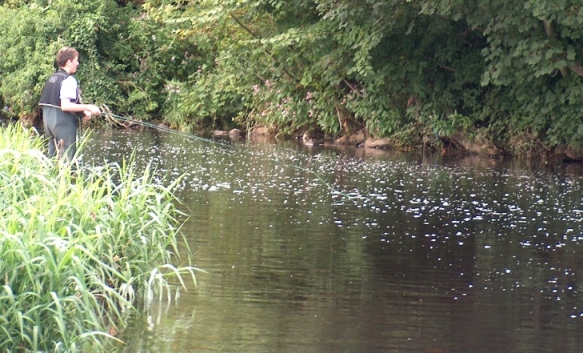 A young angler casts for brown trout in the Scotch Mill Hole at Castledawson